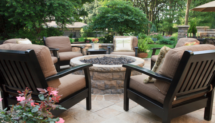 A fire pit is a great way to add light, warmth, and the good vibes.